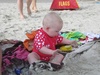Olive enjoying the sand