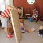 Dad helps with the unwrapping