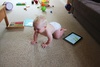 Elevan months and crawling and pulling herself up on the couch and coffee table.