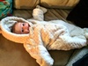 Trying on Olives bear outfit
