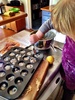 Flying 12 hours solo! We had a ball. One of the twelve hours: Iris slept under the gym and olive and I made muffins. Olive is getting a lot better at sifting flour and was really careful with spooning out the mixture. A blueberry for each muffin!