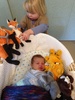 To wake up Iris this morning, Olive showered her with 'baby' soft toys.