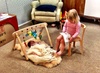 Olive is finally back to her usual happy self after having her worst cold yet. Here she has pulled up a chair to read Iris a story.