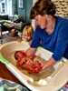 Iris' first bath! A bit of a shock to her sleepy system.