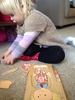 Mad about puzzles! The concentration is amazing. She will complete it and say 'done it' and wait for some reaction, smile and then tip it over and starts all over again. We can last at puzzles for a good 30min.