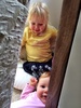 Iriee has discovered olive's chair cave. Olive is fantastic at letting Iriee in on the fun.