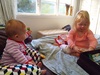 Iriee is sitting, well she has been able to do it for a little while but still with a bit of cushion help! She also has her first tooth!!!
