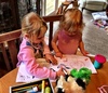 Olive took her time showing Iris how to draw a cow.