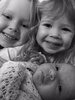 Sisters. The big sister, the little big sister and little sister.
