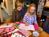 Olive taking Iris through the dozens of birthday cards sheâ€™d made for her at school in the weeks leading up to her birthday.