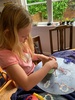 Lockdown day fourteen: making string eggs for Easter hunt. Lots of letter writing to friends, scootering around the busy park and a visit from a kereru.