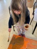 KPC Tamariki Nui: at Ben burn park, painting boxes and sliding down the hills, ball and parachute play.