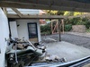 Reno day 3: gutting the two rooms, finding 2 mummified rats and bird nests to boot. Carport roof is no more.