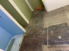 Bathroom gets waterproofed and Ravi does the tiling. Such a skill!