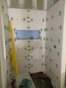 Bathroom gets waterproofed and Ravi does the tiling. Such a skill!