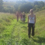 Meandering through grassy meadows.
