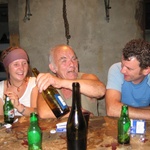 The Sheriff (middle) shows Kristin and Andre how to pour the wine on the first night.