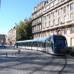 Tram and cars