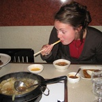 Dipping in egg, then sauce and into your mouth!