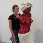 This poor women was coated with fake red fingernails.