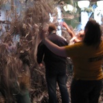 Kids throwing around ripped up newspaper