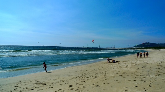The sky was littered with kite surfers.