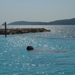 Gini in a salt pool by the sea