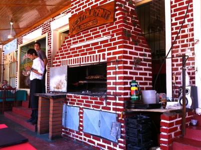 Parrilla Steak House with the BBQ out on the side walk.