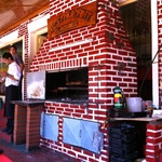 Parrilla Steak House with the BBQ out on the side walk.