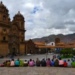 Peruvian's all in a row. Love the pig tails and bowler hats