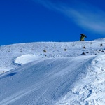 Snow boarder rail sliding a chair lift (or so it seems)
