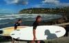 A couple of hardcore surfers emerge from the waves of Sumner Beach, Christchurch. Hardcore!