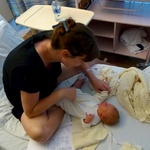 Preparing Olive in Nana's outfit.