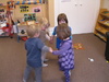 Olive doing the Pigeon song at Play Group. My Pigeon House My pigeon house I open wide And set my pigeons free. They fly so high they touch the sky And light on the tallest trees. And when they return from their merry flight I shut the door and I say goodnight. Coo roo, coo roo, coo roo, coo roo.