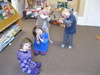 Olive doing the Pigeon song at Play Group. My Pigeon House My pigeon house I open wide And set my pigeons free. They fly so high they touch the sky And light on the tallest trees. And when they return from their merry flight I shut the door and I say goodnight. Coo roo, coo roo, coo roo, coo roo.